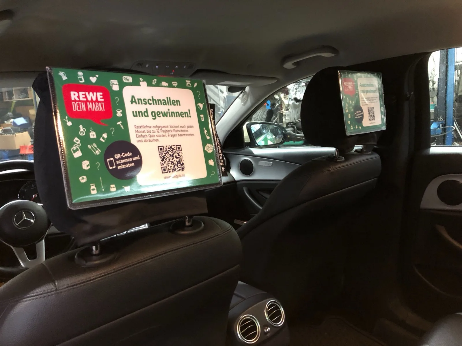 REWE headrest ad with QR code prize draw